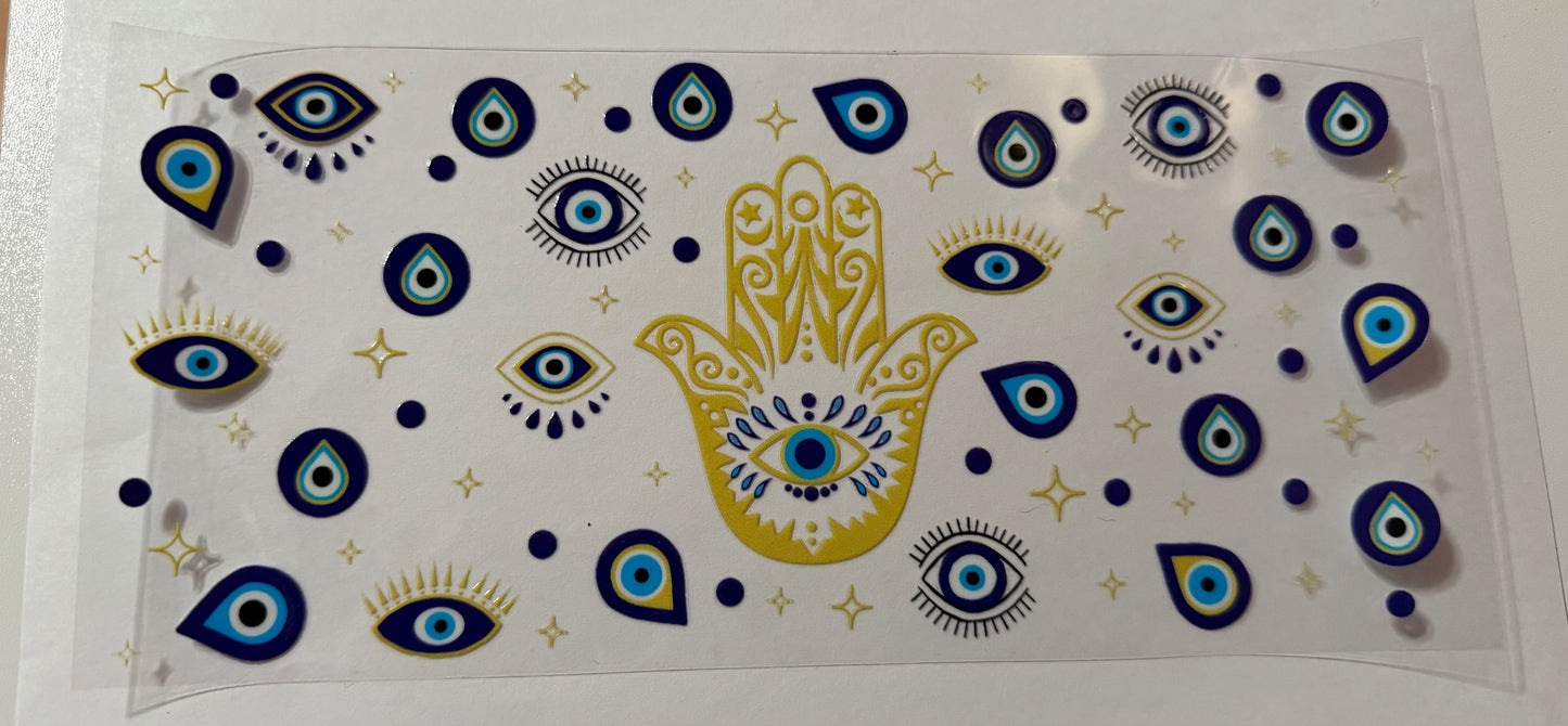 Blue eye in small gold hand