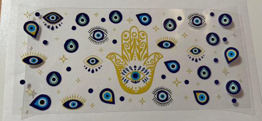 Blue eye in small gold hand