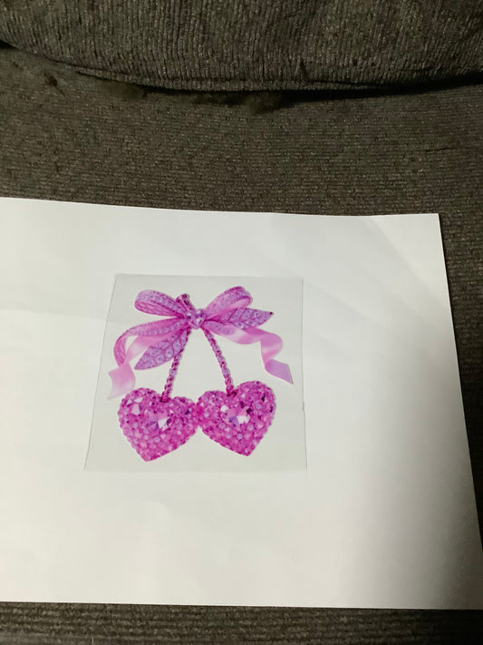 Pink hearts on a ribbon